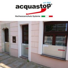 Hochwasserschutzsystem von Acquastop an einem Gebäude mit zwei Fenstern.